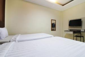Postel nebo postele na pokoji v ubytování Hotel Istana Bungur