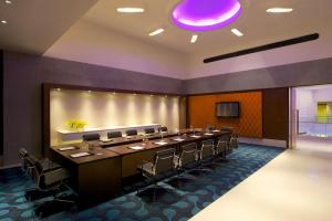 a large conference room with a long table and chairs at Avasa Hotel in Hyderabad