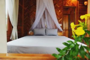 Postel nebo postele na pokoji v ubytování Cay Sao Resort