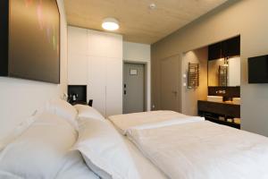 Postel nebo postele na pokoji v ubytování WUD hotel