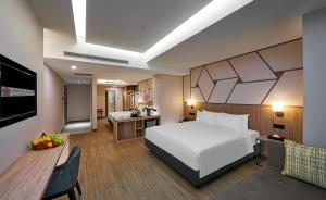 Postel nebo postele na pokoji v ubytování Swiss-Garden Hotel Bukit Bintang Kuala Lumpur