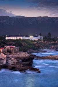 a large body of water with a lighthouse at The Marine Hermanus in Hermanus