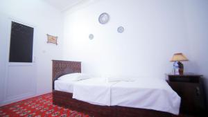 Katil atau katil-katil dalam bilik di Qutlug Qadam Guest House