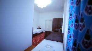 Katil atau katil-katil dalam bilik di Qutlug Qadam Guest House