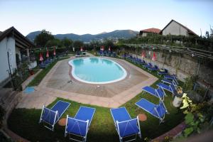 a large pool with chairs at Rabbit in Agerola
