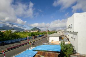 a building with a blue tarp on the side of a street at RedDoorz near Taman Kota Ternate in Ternate