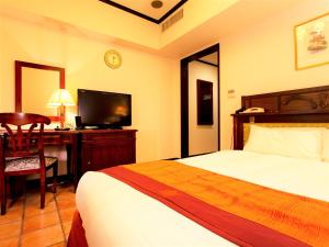 Postel nebo postele na pokoji v ubytování Hotel Monterey Osaka