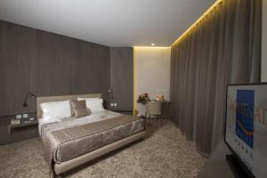Letto o letti in una camera di Promenade Hotel