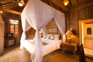 Ein Bett oder Betten in einem Zimmer der Unterkunft Umasari Rice Terrace Villa by AGATA