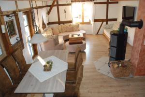 a living room with a table and a couch at Ferienwohnung Christina in Vaihingen an der Enz