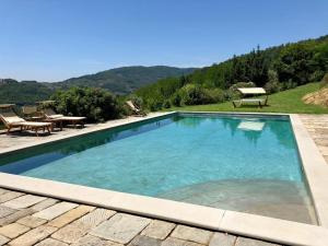 a swimming pool with a view of a mountain at Podere La Fausta in Serravalle Pistoiese