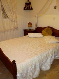 Ένα ή περισσότερα κρεβάτια σε δωμάτιο στο Villa Rita - Porto Heli