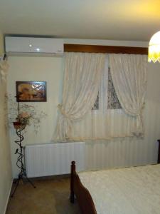 Ένα ή περισσότερα κρεβάτια σε δωμάτιο στο Villa Rita - Porto Heli
