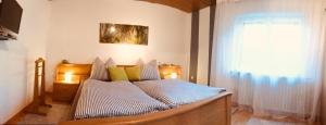 Postel nebo postele na pokoji v ubytování Ferienwohnung zum Nationalpark
