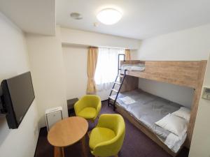 Un ou plusieurs lits dans un hébergement de l'établissement Hotel Shin Osaka