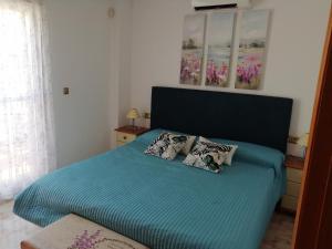 Ένα ή περισσότερα κρεβάτια σε δωμάτιο στο Luxury and comfort in La Marina, with sea views at El Pinet beach