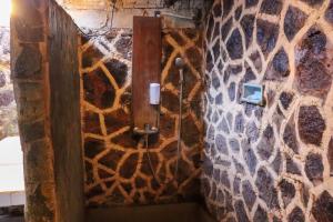a wall with a giraffe print on it at Eka Purnama Cottages in Amed