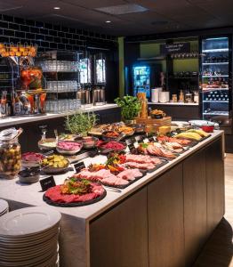 a buffet line with many different types of food at Thon Hotel Maritim in Stavanger