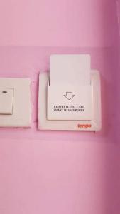 two white boxes sitting on top of a pink table at Makkasan Happy Home in Bangkok