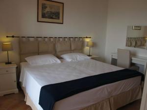 Un pat sau paturi într-o cameră la Casa Margherita