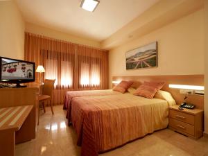 Posteľ alebo postele v izbe v ubytovaní Hotel Anna