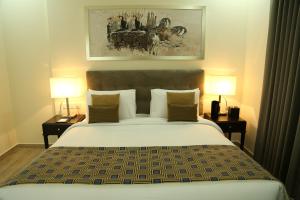 Postel nebo postele na pokoji v ubytování Uptown Hotel Apartment Fujairah By Gewan