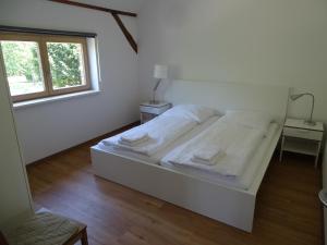 Ein Bett oder Betten in einem Zimmer der Unterkunft Havelhof-Nitzow
