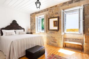 Postel nebo postele na pokoji v ubytování Quinta do Valdalágea