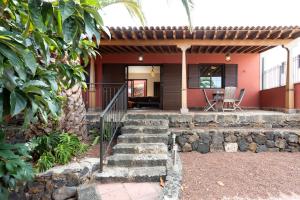 a house with stairs leading to the front of it at Villa Santa Rosa Tenerife in Tacoronte