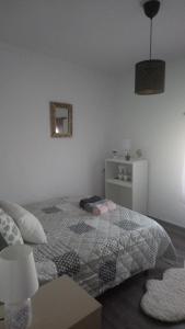 Łóżko lub łóżka w pokoju w obiekcie Maribella chambres à louer