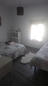 Łóżko lub łóżka w pokoju w obiekcie Maribella chambres à louer