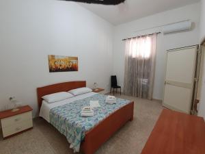 Postel nebo postele na pokoji v ubytování Casa Francy a 5min da Marzamemi