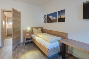 Postel nebo postele na pokoji v ubytování Ferienwohnungen Appartementhaus Hohe Tauern