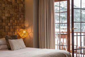 Giường trong phòng chung tại Grau Roig Andorra Boutique Hotel & Spa