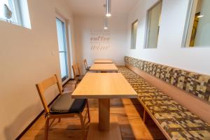 a row of tables and chairs in a room at Gästehaus Moser in Mönchhof