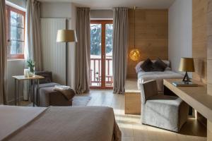 Giường trong phòng chung tại Grau Roig Andorra Boutique Hotel & Spa