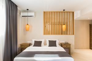 מיטה או מיטות בחדר ב-Calmare suites