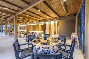 a group of tables and chairs in a room at Stella Palace Aqua Park Resort in Hersonissos