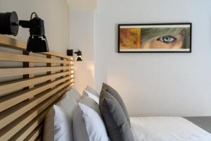 Postel nebo postele na pokoji v ubytování Fos DownTown Suites