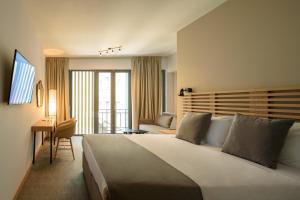 Postel nebo postele na pokoji v ubytování Fos DownTown Suites