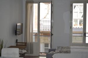 Łóżko lub łóżka w pokoju w obiekcie Modern studio flat close to Plaza Merced
