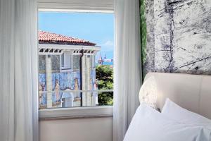 Postel nebo postele na pokoji v ubytování Ausonia Hungaria Wellness & Lifestyle