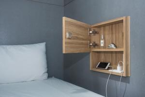 Voodi või voodid majutusasutuse Liuqiu Dive Hostel toas