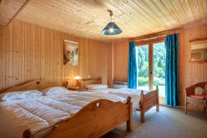 Een bed of bedden in een kamer bij Chalet Clairvaux