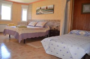 Katil atau katil-katil dalam bilik di El Mirador de Clavijo