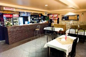 a restaurant with tables and chairs and a bar at Usługi Hotelarskie Las Vegas in Międzyrzec Podlaski +34 photos