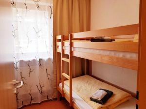 Katil atau katil-katil dalam bilik di Berg-Bungalows Leinleitertal