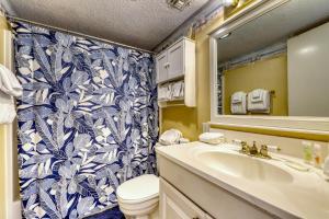 a bathroom with a toilet and a sink and a shower at Plantation West Resort II in Gulf Shores