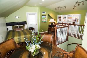 a bedroom with a bed and a table and chairs at Fairview Inn in Jackson