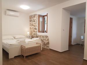 Posteľ alebo postele v izbe v ubytovaní Apartments Jungic, Rab